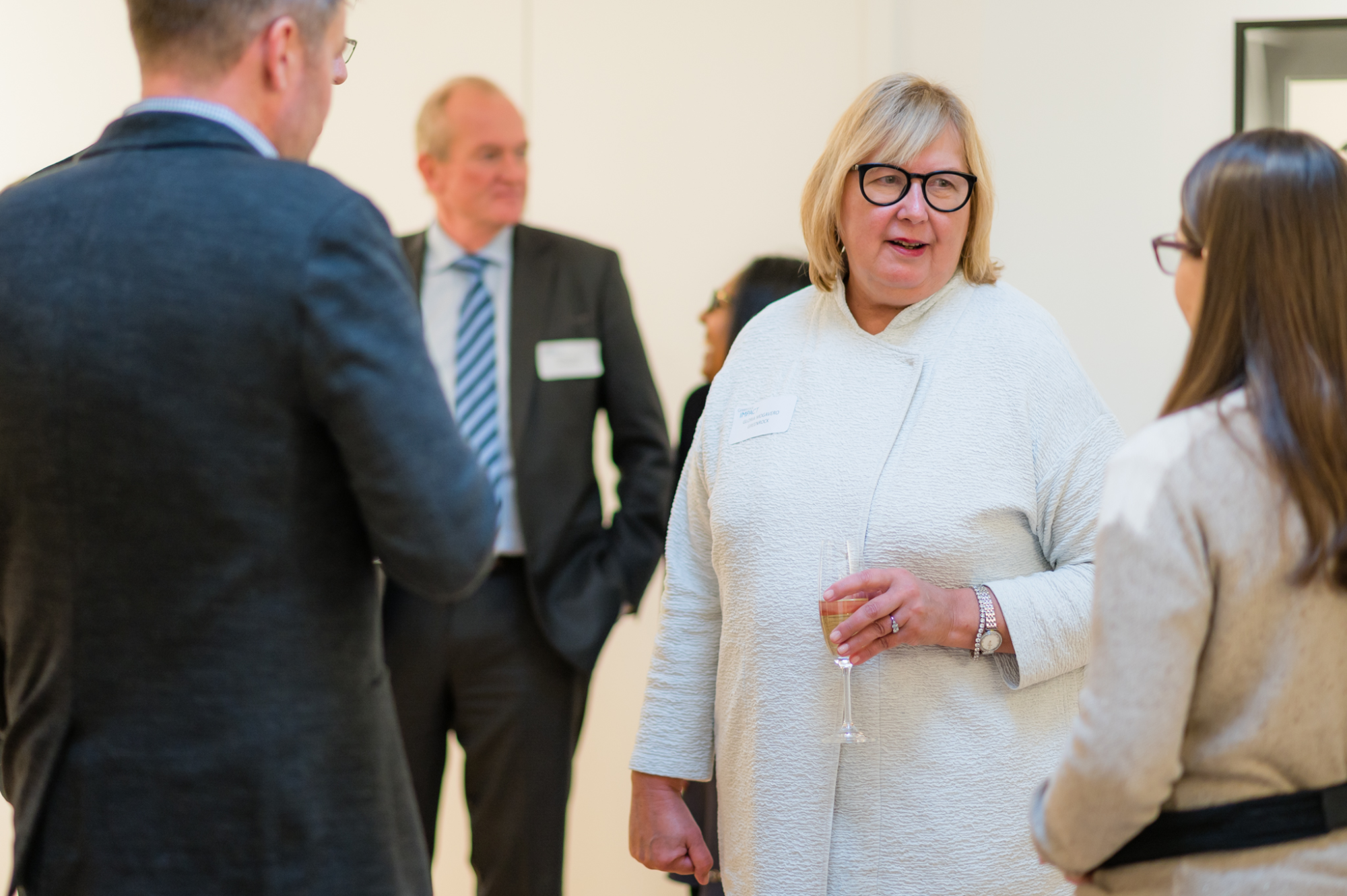 Gloria chatting with colleagues