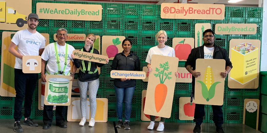 Group photo of IMPACT Committee volunteering at Daily Bread Food Bank