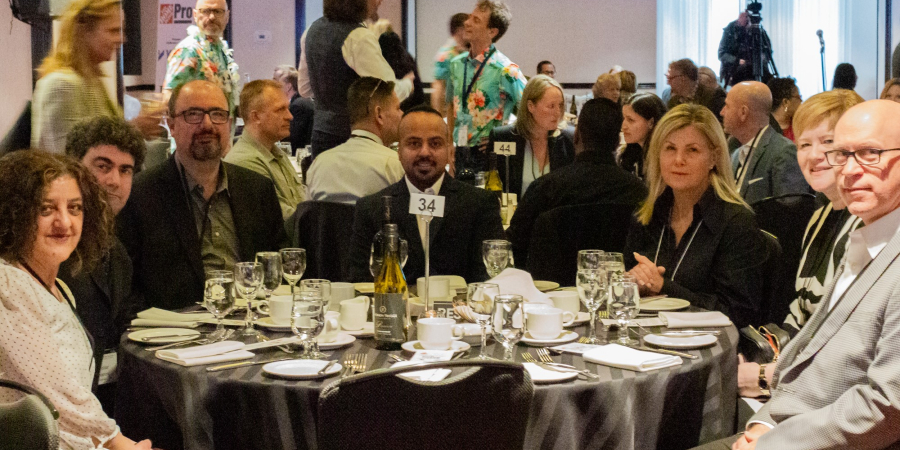 group shot of Greenrock team at CFAA awards gala table